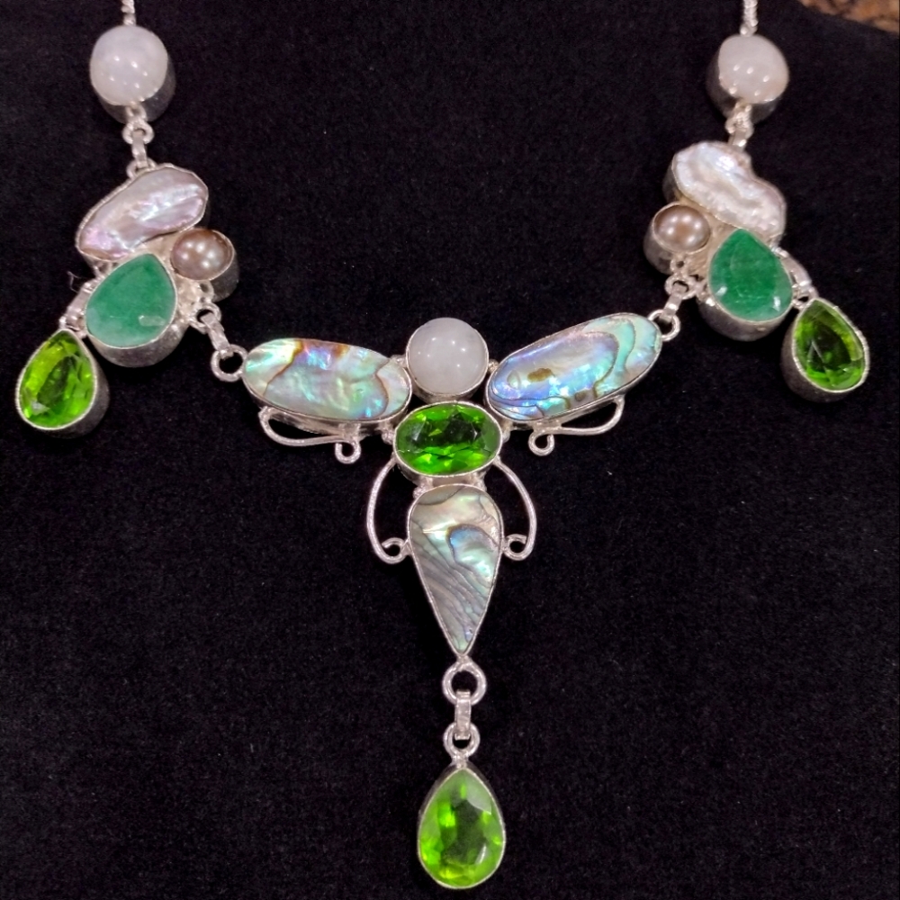 Abalone shell, peridot, biwa shell, moonstone, raw emerald silver neckla…